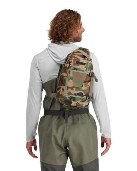 Geanta SIMMS Tributary Sling Pack Woodland Camo